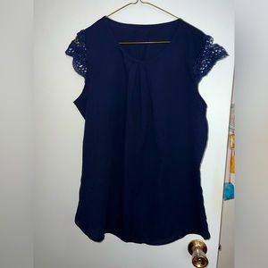 Light navy blue top with cap sleeve.
